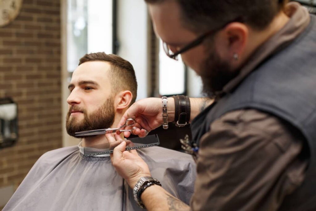 Top G Barber, Barber shaving client's beard